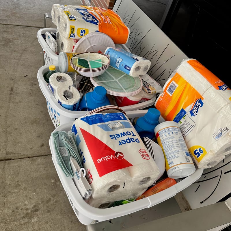 Dignity basket filled with new household essentials for a veteran